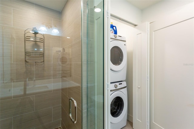 washroom featuring stacked washer and dryer