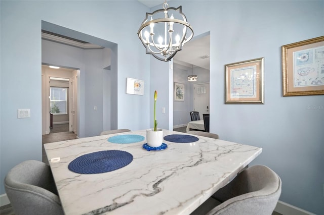 dining room featuring a notable chandelier