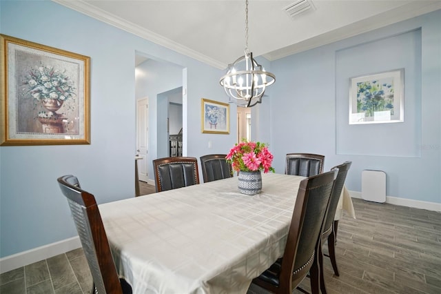 dining area with crown molding and an inviting chandelier