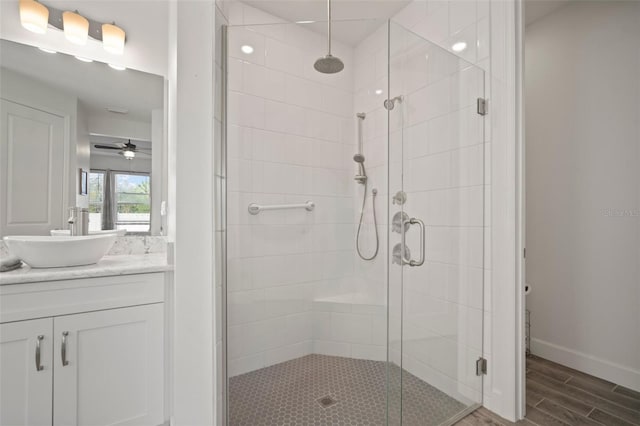 bathroom featuring vanity and an enclosed shower