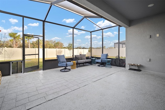 view of patio / terrace with an outdoor living space and glass enclosure