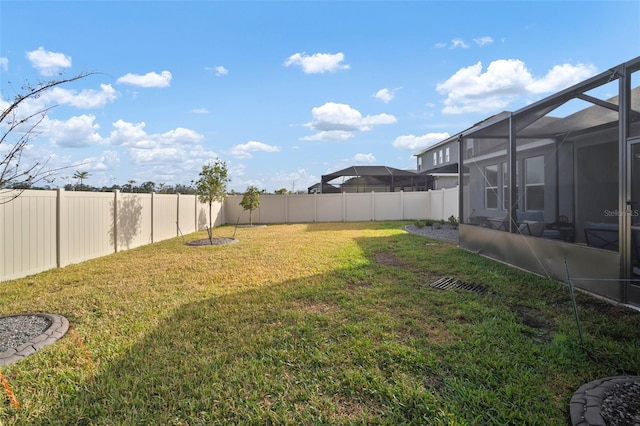 view of yard featuring a lanai