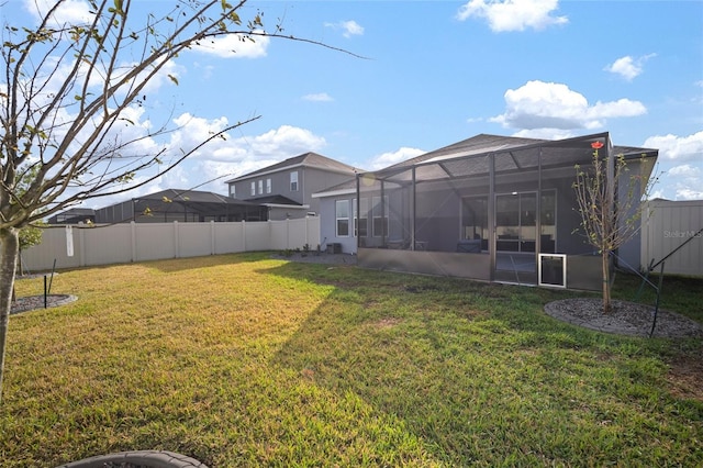 view of yard featuring glass enclosure