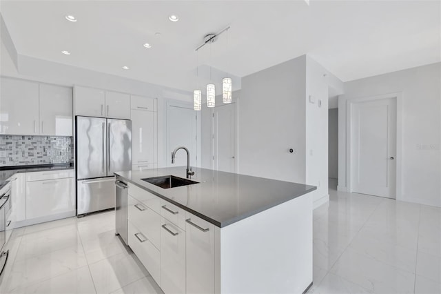 kitchen with white cabinetry, sink, decorative light fixtures, and appliances with stainless steel finishes