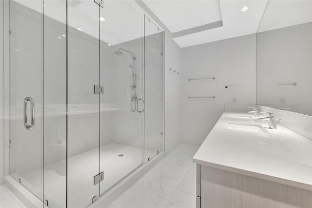 bathroom with vanity and a shower with shower door