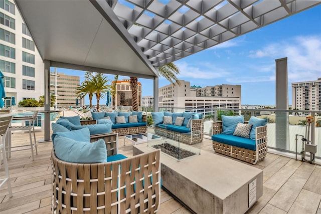 view of patio / terrace featuring an outdoor living space with a fire pit