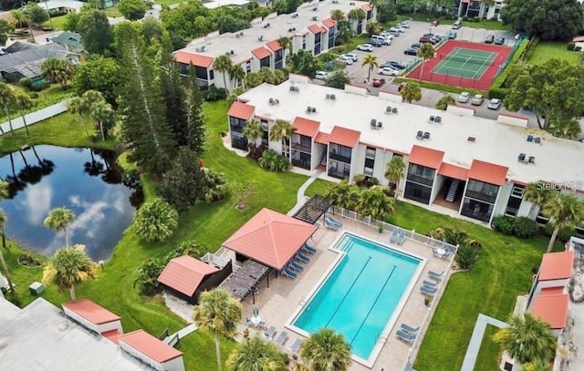 bird's eye view featuring a water view and a residential view