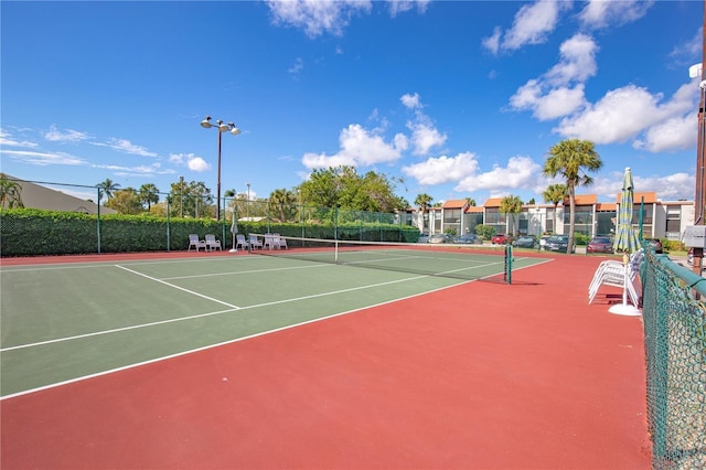 view of sport court featuring community basketball court and fence