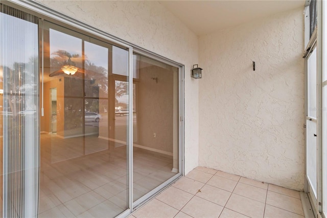 property entrance with stucco siding