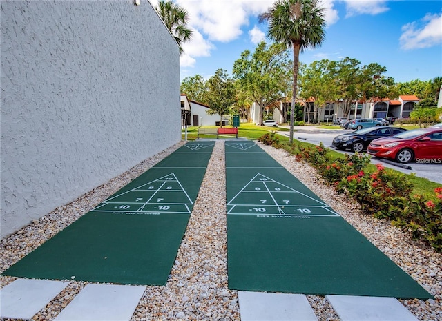 surrounding community featuring shuffleboard and a residential view