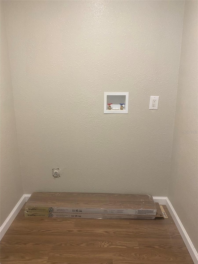 laundry room with washer hookup and hardwood / wood-style floors