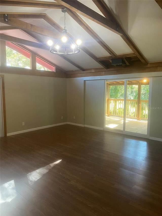 spare room with lofted ceiling with beams, dark hardwood / wood-style floors, and an inviting chandelier