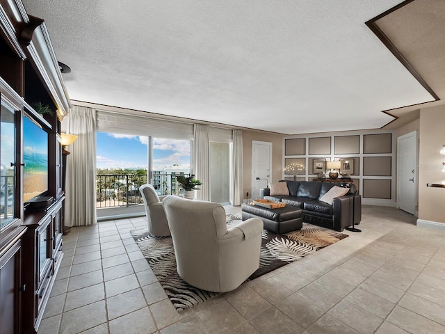 living room featuring light tile patterned floors and a textured ceiling