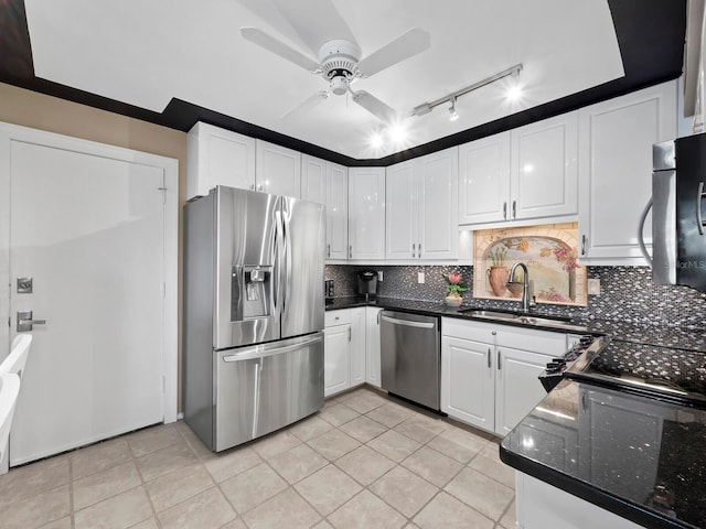 kitchen featuring backsplash, white cabinets, sink, ceiling fan, and appliances with stainless steel finishes