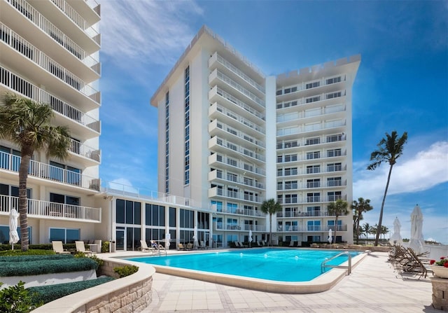 view of swimming pool with a patio