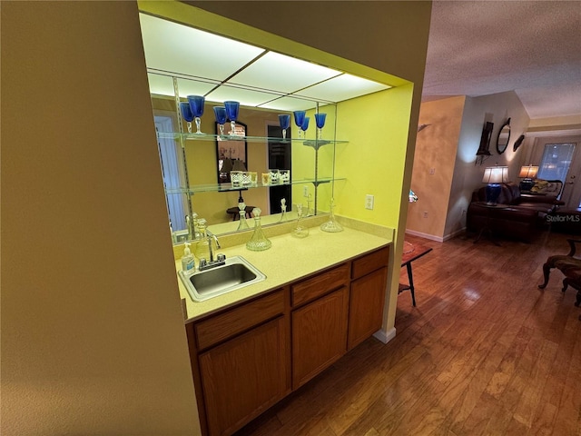 interior space featuring sink, hardwood / wood-style floors, and a textured ceiling