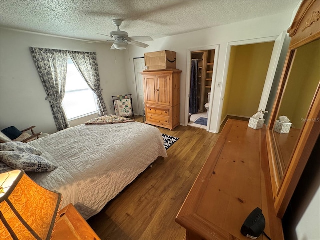 bedroom with ceiling fan, a textured ceiling, and light hardwood / wood-style flooring