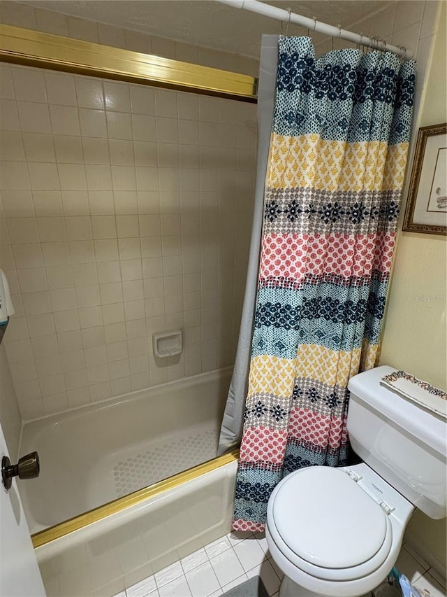 bathroom with toilet, tile patterned floors, and shower / bath combo with shower curtain