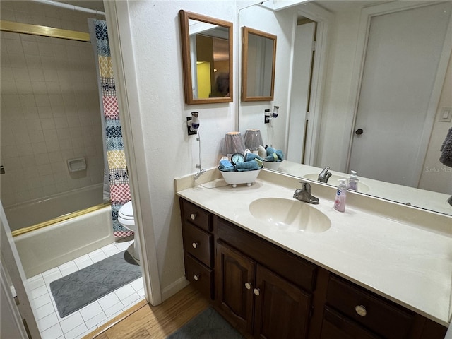 full bathroom featuring vanity, tile patterned floors, toilet, and shower / bathtub combination with curtain