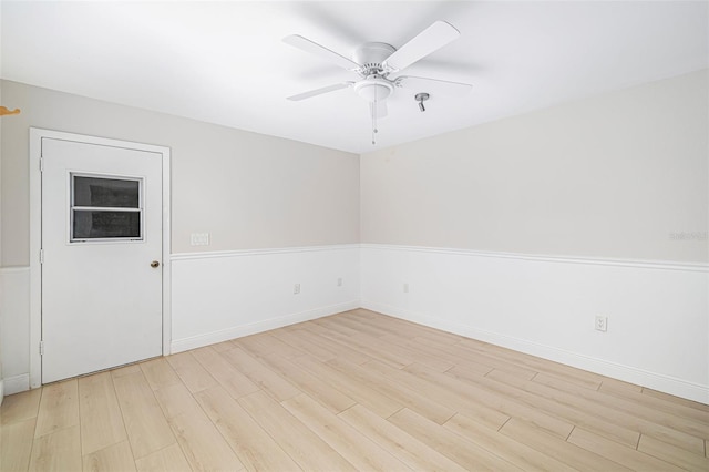 spare room with ceiling fan and light hardwood / wood-style flooring