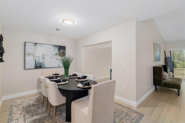 dining area featuring light wood-type flooring