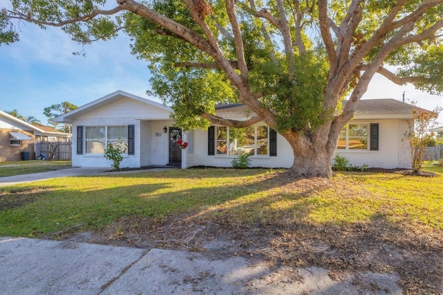 ranch-style house with a front yard