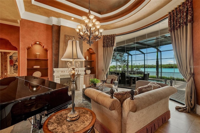 interior space featuring a raised ceiling, a water view, a towering ceiling, ornamental molding, and a notable chandelier