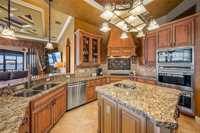 kitchen featuring stainless steel dishwasher, pendant lighting, crown molding, and sink