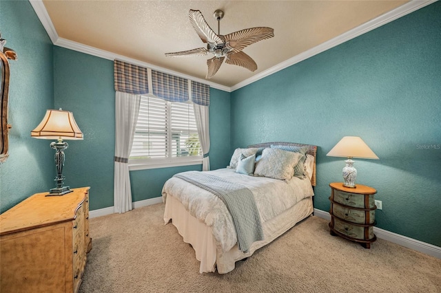 carpeted bedroom featuring ceiling fan and ornamental molding