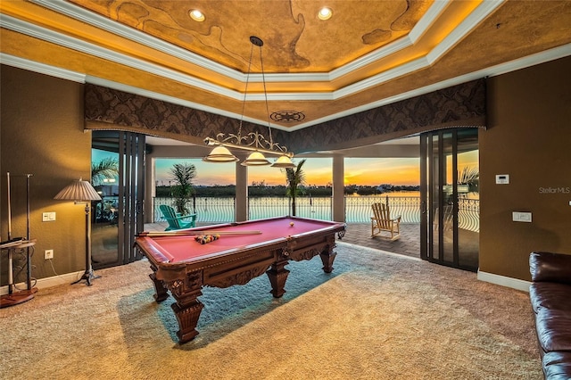 recreation room with carpet flooring, a raised ceiling, crown molding, a water view, and billiards