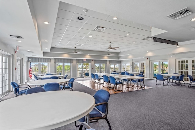 dining space featuring a wealth of natural light, french doors, and ceiling fan