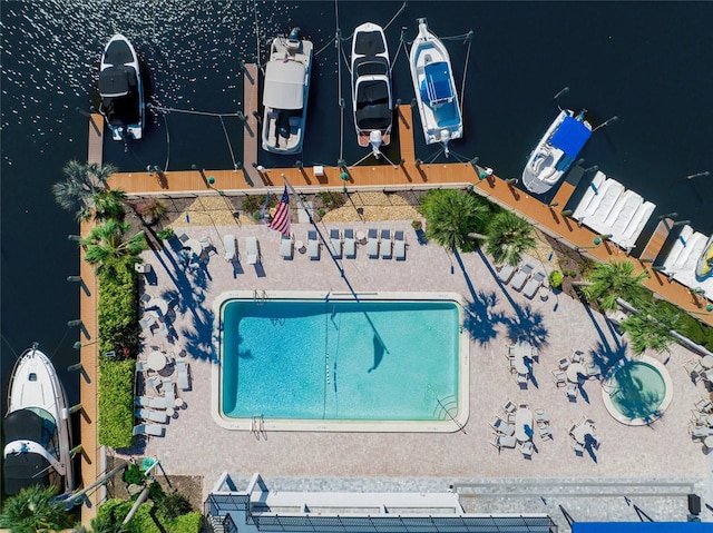 birds eye view of property featuring a water view