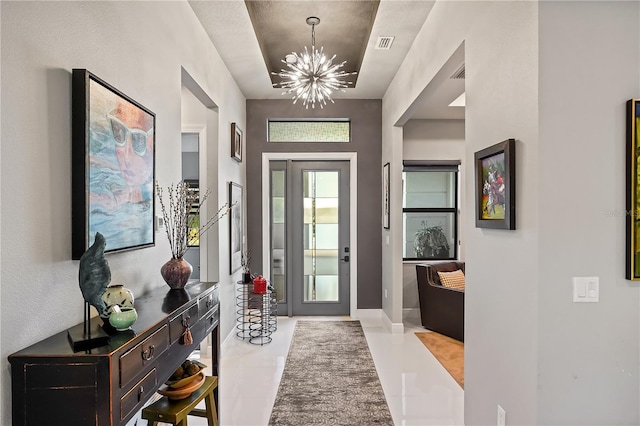 entryway featuring a notable chandelier