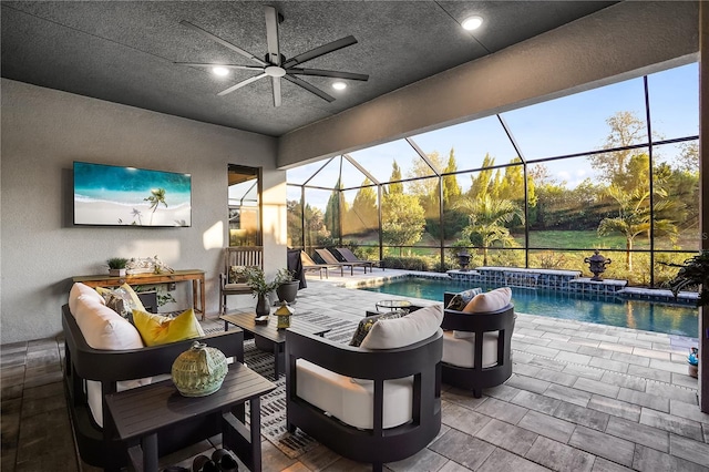 view of patio / terrace with an outdoor living space, a lanai, pool water feature, and ceiling fan