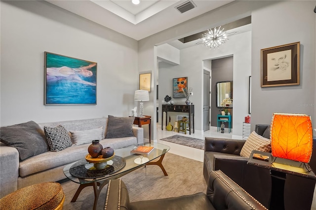 living room featuring a notable chandelier