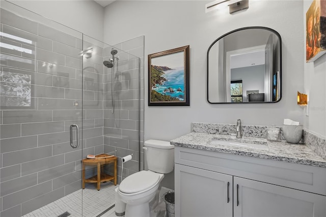 bathroom with vanity, toilet, and walk in shower