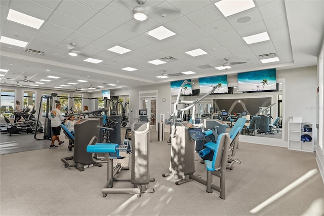 gym with a paneled ceiling