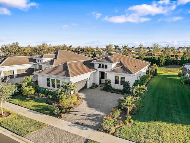 view of front of property featuring a garage and a front yard