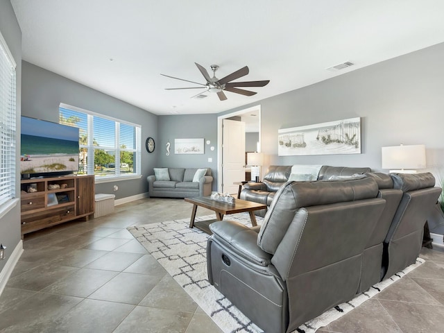 tiled living room featuring ceiling fan