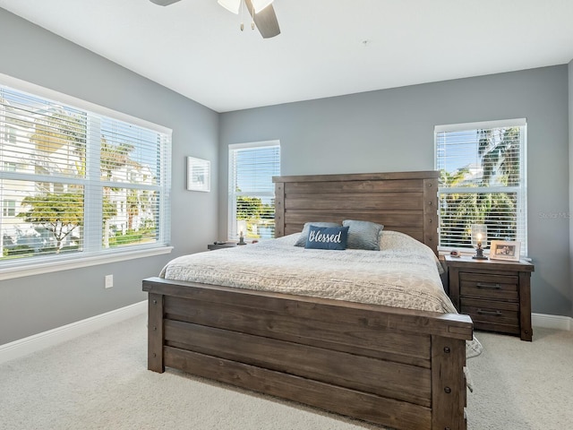 3450 77th St W Unit 102, Bradenton, FL 34209 - bedroom featuring light carpet and a ceiling fan