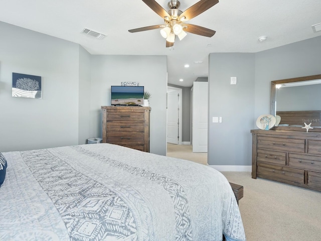 bedroom with ceiling fan and light colored carpet