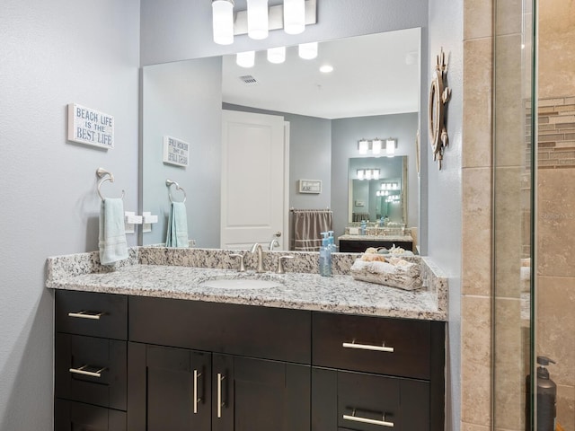 3450 77th St W Unit 102, Bradenton, FL 34209 - full bathroom featuring vanity and a tile shower