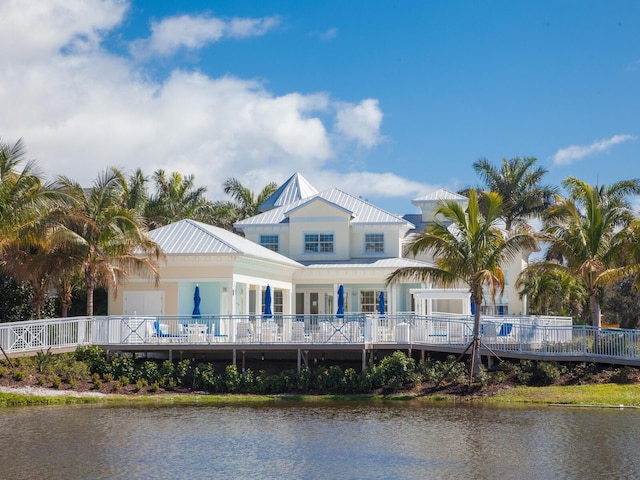 rear view of house with a water view