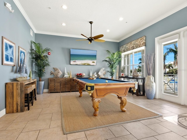 playroom featuring ceiling fan, ornamental molding, a textured ceiling, pool table, and light tile patterned flooring