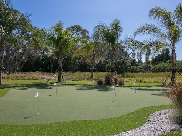 3450 77th St W Unit 102, Bradenton, FL 34209 - view of community with a putting green and view of scattered trees