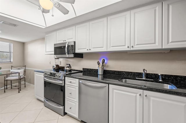 kitchen featuring ceiling fan, sink, white cabinets, and appliances with stainless steel finishes