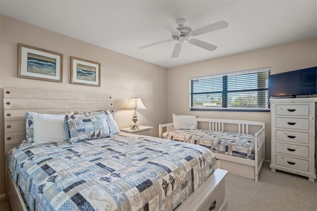 bedroom featuring light carpet and ceiling fan