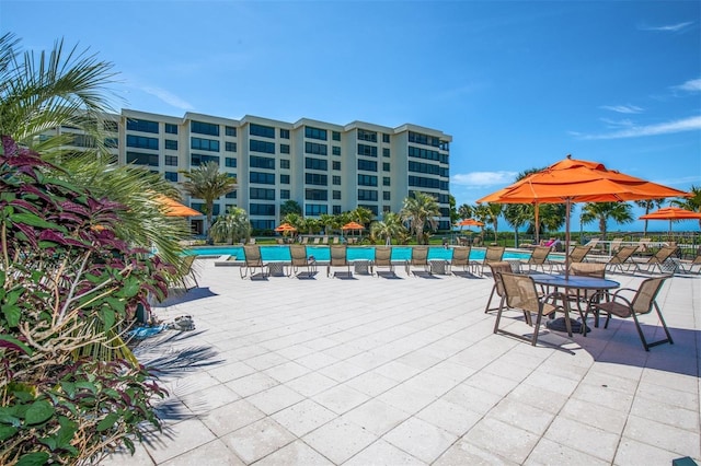 view of patio featuring a community pool