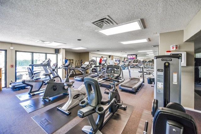 workout area with a textured ceiling