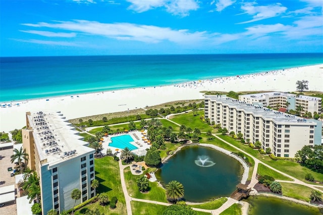 aerial view featuring a water view and a beach view